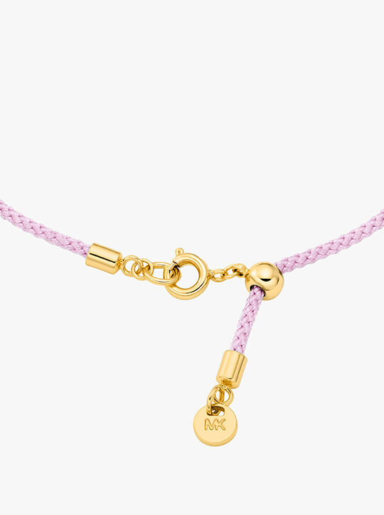 michael kors pav  gold tone logo corded bracelet