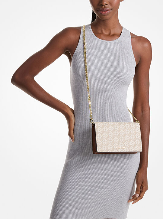 حقيبة كروس بودي جيت سيت متوسطة الحجم بشعار الماركة michael kors حقيبة كروس بودي جيت سيت متوسطة الحجم بشعار الماركة