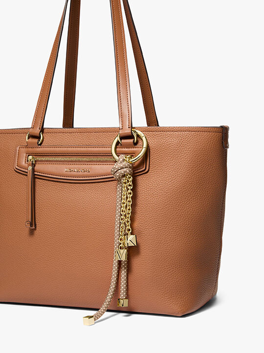 حقيبة تعليقة الحبل باللون الذهبي والمرقط michael kors حقيبة تعليقة الحبل باللون الذهبي والمرقط