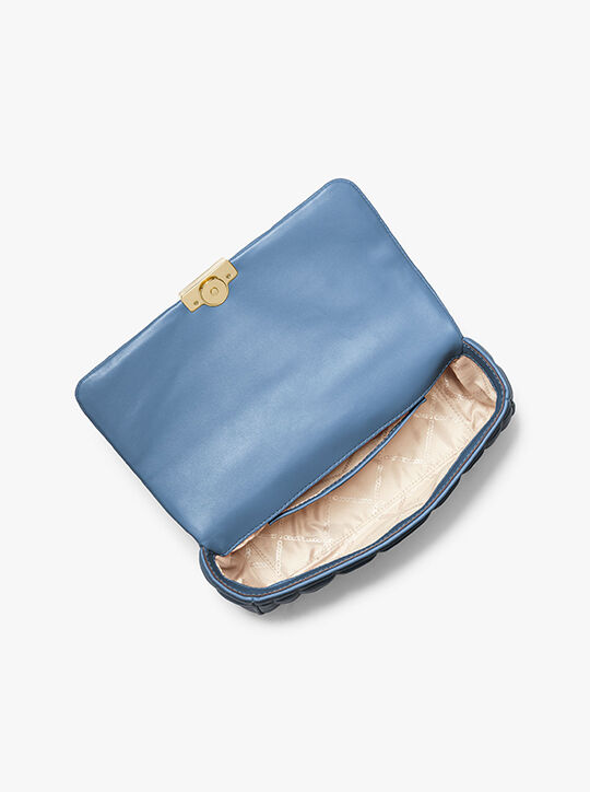 حقيبة كتف تريبيكا كبيرة من الجلد المبطن michael kors حقيبة كتف تريبيكا كبيرة من الجلد المبطن