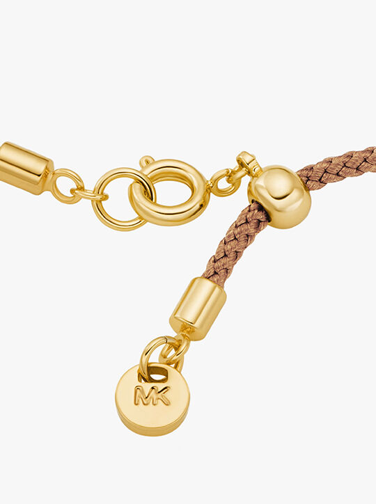 michael kors سوار مرصع بشعار الماركة ذهبي اللون